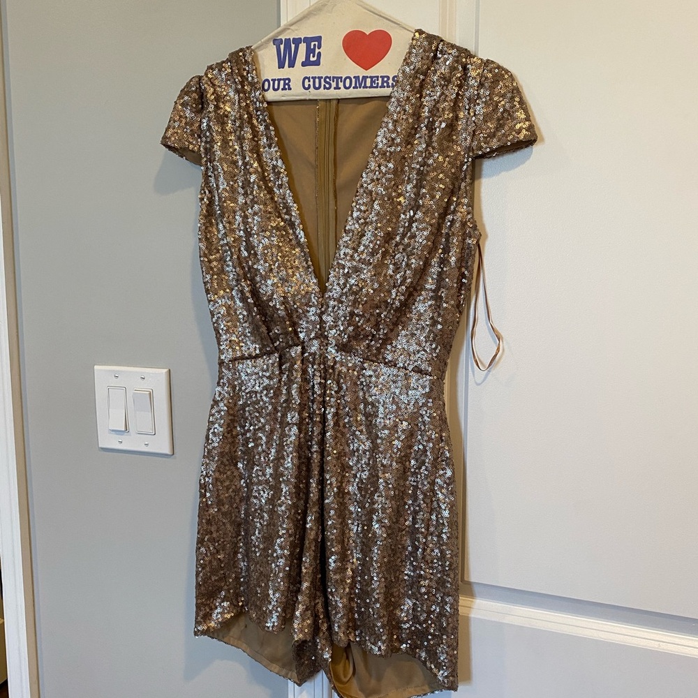 Slightly worn gold sparkly romper